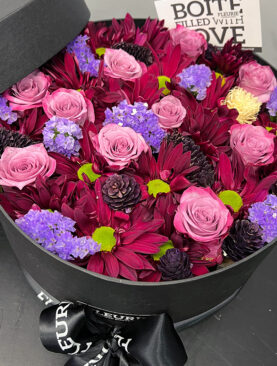 PURPLE MIXED FLOWERS - ROUND BLACK BOX CLOSED